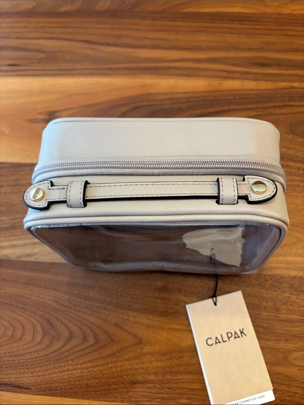 NWT New Calpak Beige Clear Travel Cosmetic Case